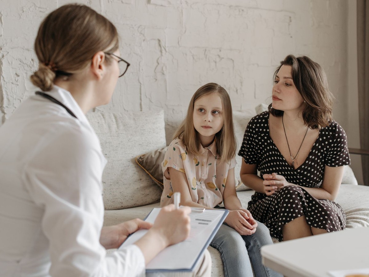 Doctor consulting with a mother and child
